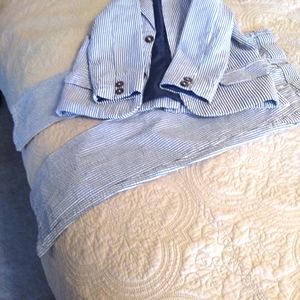 A young boy searsucker suit
